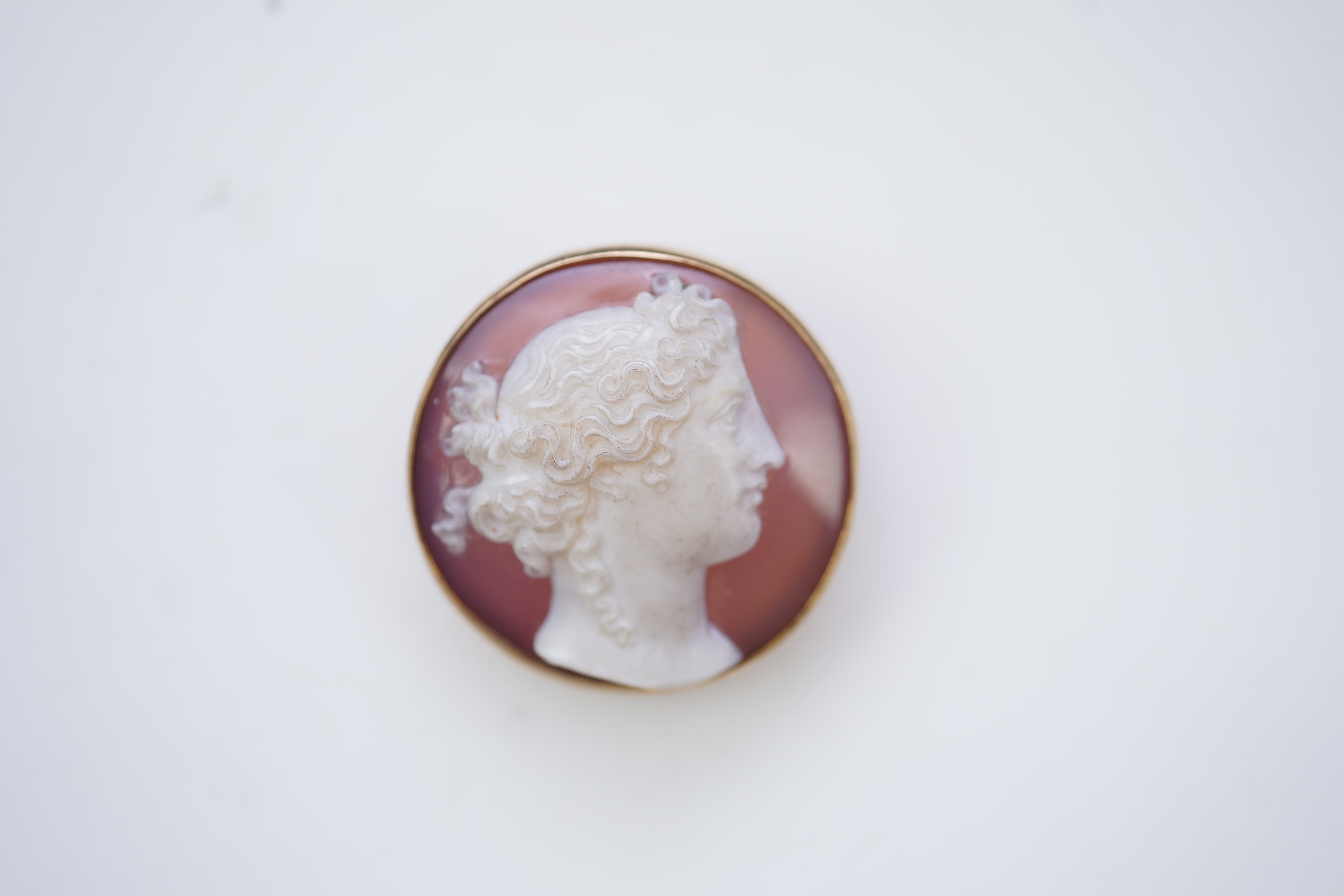 A Victorian onyx cameo brooch, late 19th century